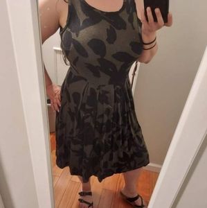 Black and green patterned fit and flare pleated tank dress